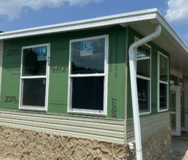 Enclosure exterior Exterior view of an enclosure with windows and wall sheathing