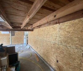 Interior roof framing Exposed roof beams and interior wall sheathing
