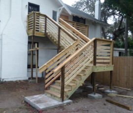 Stairs and landing Completed wooden exterior stairs with railings and landing